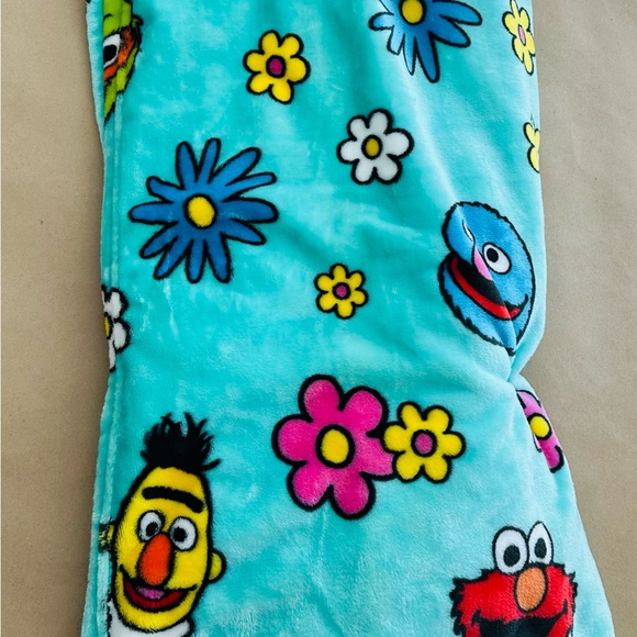 Sesame Street Turquoise Blanket with Vibrant Floral Design - Picture 1 of 5